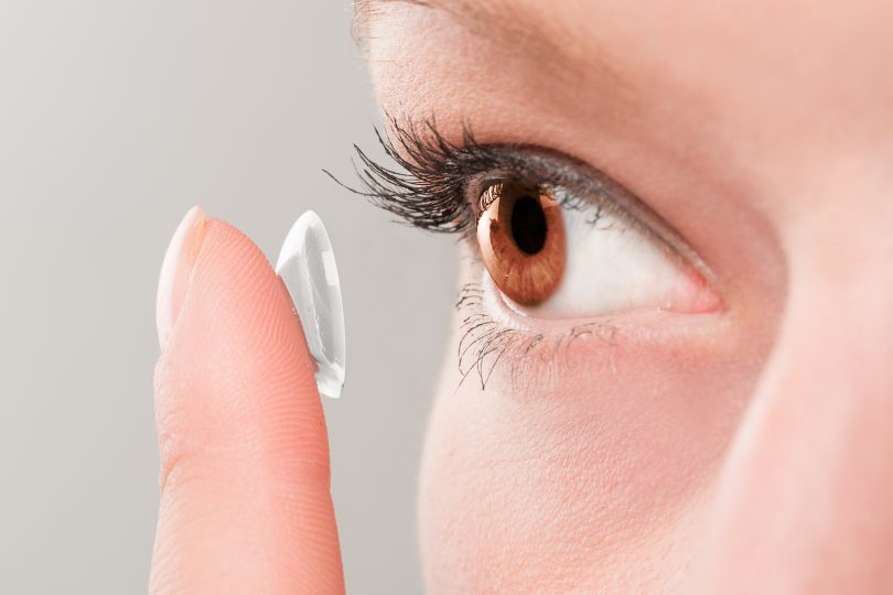 bigstock-Woman-Inserting-A-Contact-Lens-120552371-810x540