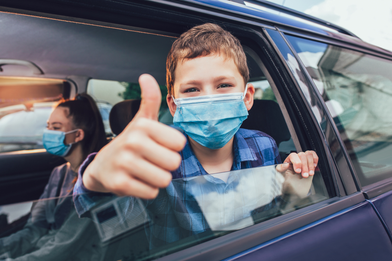 Kids are travelling in car during coronavirus outbreak Kids are travelling in car during coronavirus outbreak
