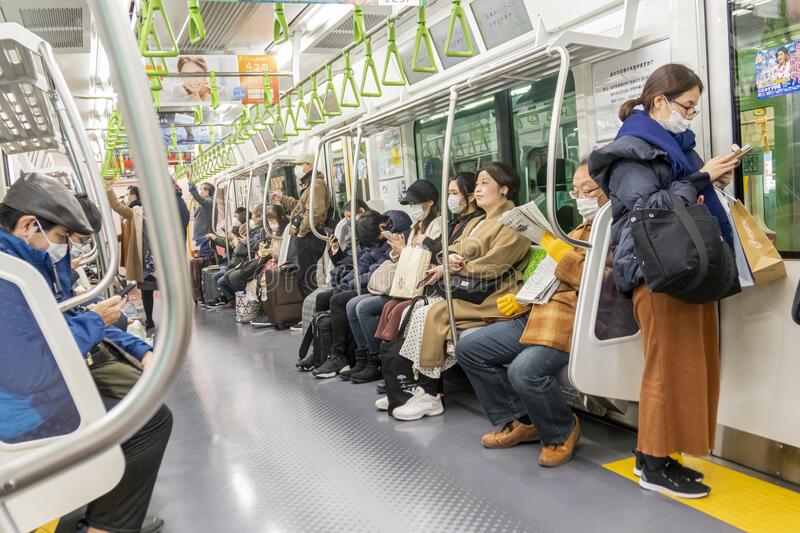 japanese-people-subway-train-some-wearing-mask-masks-to-protect-themselves-coronavirus-covid-which-spreads-174614383