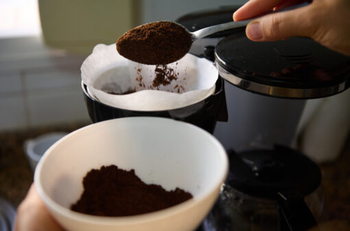 Preparing fresh coffee with a drip coffee maker in the kitchen