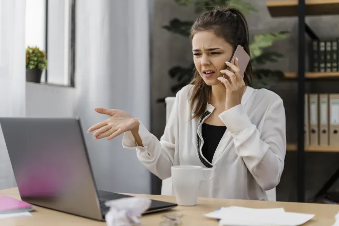 businesswoman-having-bad-call-from-work