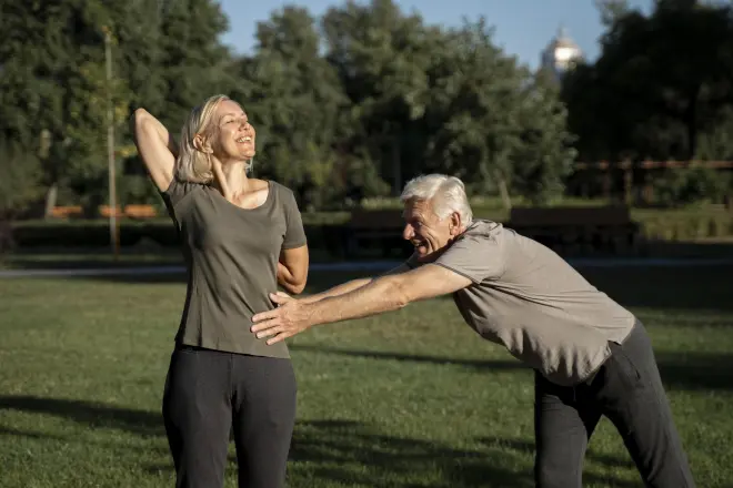 mature-couple-stretching-outdoors